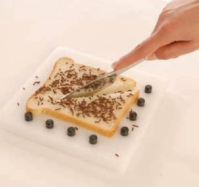 Snijplank met 8 zwarte noppen afm. 18x18cm.